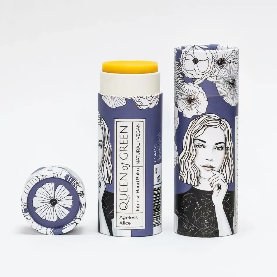 Handcreme Stick in violetter Kartonhülse mit weiß-schwarzen Blumenzeichnungen und Frauenporträt, daneben aufgesetzter…
